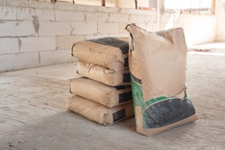 Pile of Cement in bags, stacked for a construction project.