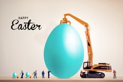  construction happy Easter. miniature worker people working on an egg, Easter holiday concept for business construction companies