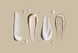 cosmetic smears of creamy texture on a pastel background