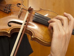 Close up on violin playing