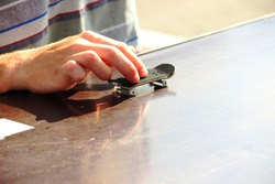 teenager's hand playing the fingerboard, close-up. fingerboard competitions, freestyle and hurdles. Finger skateboard fingerboard mini skate, selective focus