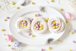 Pavlova mini cakes with Easter motif decoration, top down view