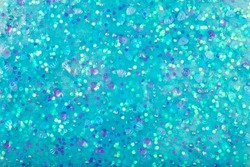 Blue abstract texture background slime with glitter and sprinkles. sticky flexible substance. closeup