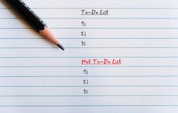 Pencil on line note sheet with text written TO DO LIST and NOT TO DO LIST,make list of tasks and habits one should do and should never do to stay focused on important things in life and career