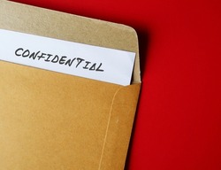 Office envelope with document typed CONFIDENTIAL, concept of data or information intended to be kept secret, secret or private, business or military top secret document
