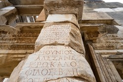 Ancient Greek inscriptions on the wall of Celsus Library in the Ephesus ancient city. Ephesus was a city in the southwest of present-day Selcuk in Izmir Province, Turkey.