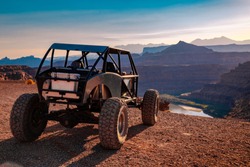 A Custom 4x4 Rock Crawler Off-Roading In The Sandstone Red Rock Terrain Outside Of Moab Utah In The American Southwest