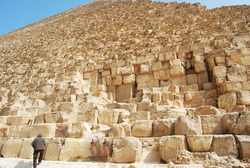 
Sandstones of the Great Pyramid of Giza. Man on the bottom left for size comparison.