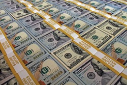 Colorful background of $100 dollar bills stacks. Money stacks laying on the table. Beautiful money background. 