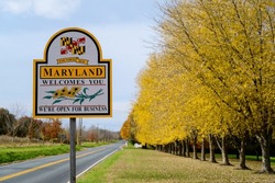 Welcome to Maryland sign with yellow trees