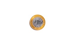 Real, Money from Brazil. A one Real coin isolated on white background. Finance and brazilian economy concepts.