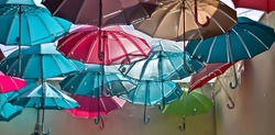 Colored umbrellas fly free
