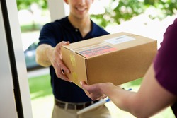 Delivery: Man Delivering Package To Homeowner