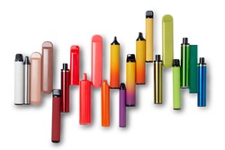 Disposable e-cigarettes on white isolated background laid out in the colors of the rainbow. The concept of modern smoking, vaping and nicotine. Top view