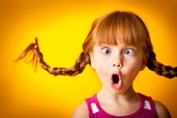 Silly, Surprised Little Girl with Pigtails