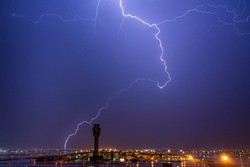 Monsoon thunderstorm over airport control tower