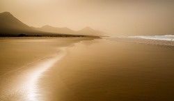 Sandstorm on Cofete Beach, Fuerteventura with Jandia Peninsula mountains in the background