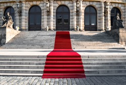 Luxorious noble red carpet on the historical stairs