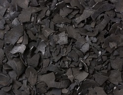 coconut shell charcoal, carbonized raw coconut shells in a limited supply of air, widely used in domestic and industrial fuel, create activated carbon, organic fertilizer, background taken from above
