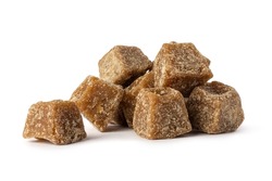 pile of jaggery pieces, golden brown colored cube shaped unrefined sugar product also called kithul jaggery or palm sugar, sweet and sugary traditional food in southeast asia