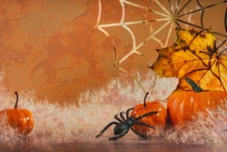 Orange Halloween pumpkins with golden spider webs and branches. Mold. happy halloween party decoration. copy space banner