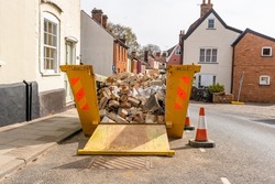 A builders skip containing rubble and bricks from a ongoing home renovation