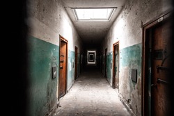 An old corridor of a creepy prison abandoned a long time ago. 