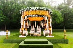 Indian wedding mandap decor yellow and white flowers