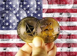 Hold physical versions of Bitcoin and Ethereum and an American flag. Concept map of US cryptocurrency and blockchain technology. Double exposure creative bitcoin symbol hologram.