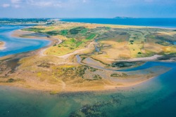Aerial view of golf island from above Malahide harbour in Dublin county, Ireland. Beach aerial view on the irish coast.