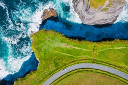 Top-down aerial view over the Irish rugged coastline at Kilkee Cliffs, Co Clare. Epic Irish  Seascape along the wild Atlantic way.The natural beauty of the cliff edge and the blue Atlantic ocean.