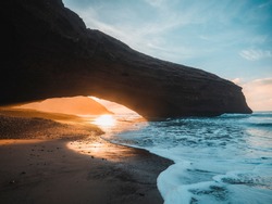 Landscape of Legzira Beach with its natural arches at the coast of Atlantic ocean. Legzira Beach is located on the ocean coast of Morocco, in Sidi Ifni, close to Agadir.