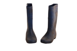 rubber boots old blue for agriculture have soil attached