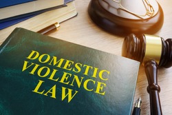 Domestic violence law on a wooden table.