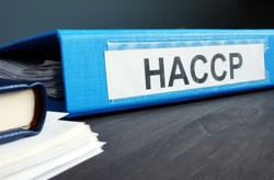Blue folder with documents HACCP Hazard Analysis and Critical Control Points.