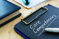 Core competencies list on the black page.