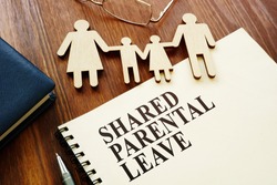 Shared Parental Leave papers and figures of family.