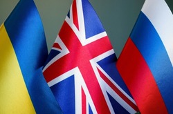 Russian Ukrainian conflict. Flags of Russia, Ukraine and Great Britain.