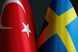 Close-up of the flags of Sweden and Turkey.