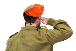 Israeli soldier with Israel flag salutes in an orange beret. White isolated background
