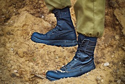 Soldier's boots on the feet of an Israeli soldier. Concept: Soldiers IDF - Israel Defense Forces (Tzahal),  IsraelI soldiers, Israeli army