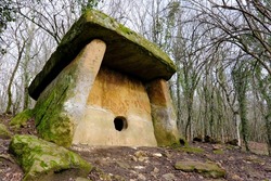 View of dolmen (2000 BC) in Pshada river valley on sunny winter day. Krasnodar Krai, Russia.