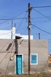 House behind electricity pole in Bofareira on the island Boa Vista of Cape Verde in Africa