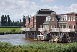 New built houses near water in a traditional architecture style in Gouda in the Netherlands