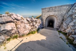 Lovcen National park. Dimly lit steep,white stone steps leading down a long narrow tunnel in the mountain from the Mausoleum of Petar II Petrovic-Njegos,at the summit.