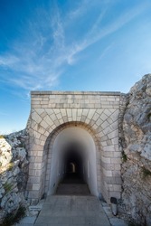 Lovcen National park. Dimly lit steep,white stone steps leading down a long narrow tunnel in the mountain from the Mausoleum of Petar II Petrovic-Njegos,at the summit.