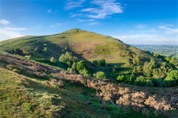 Soon after sunrise in the summer,looking southwards at the second main hill from the north of the Malvern hill range.Sugarloaf Hill lies between the Worcestershire Beacon and North Hill.