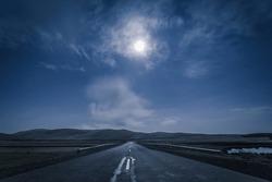 empty road in the moonlight at night