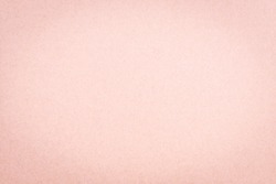 Craft paper pink or rose gold textured background