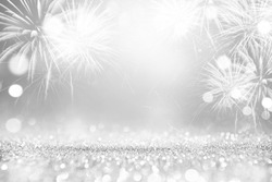 Silver and white Fireworks and bokeh in New Year eve and copy space. Abstract background holiday.